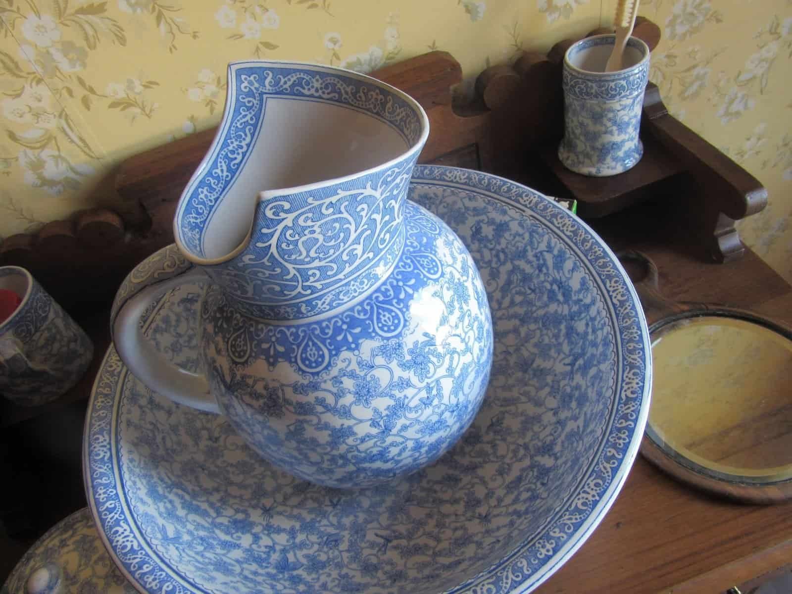Blue antique water pitcher and bowl.