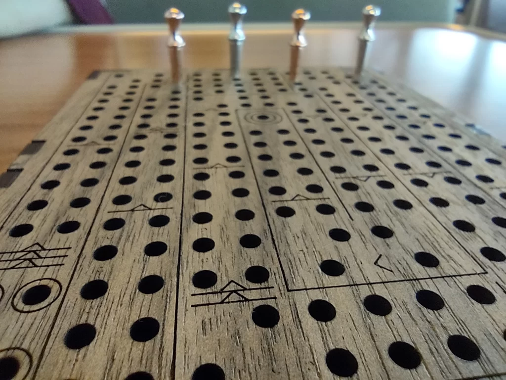 Close up of a wooden cribbage board. A game you can play on the ferry over to San Juan Island.