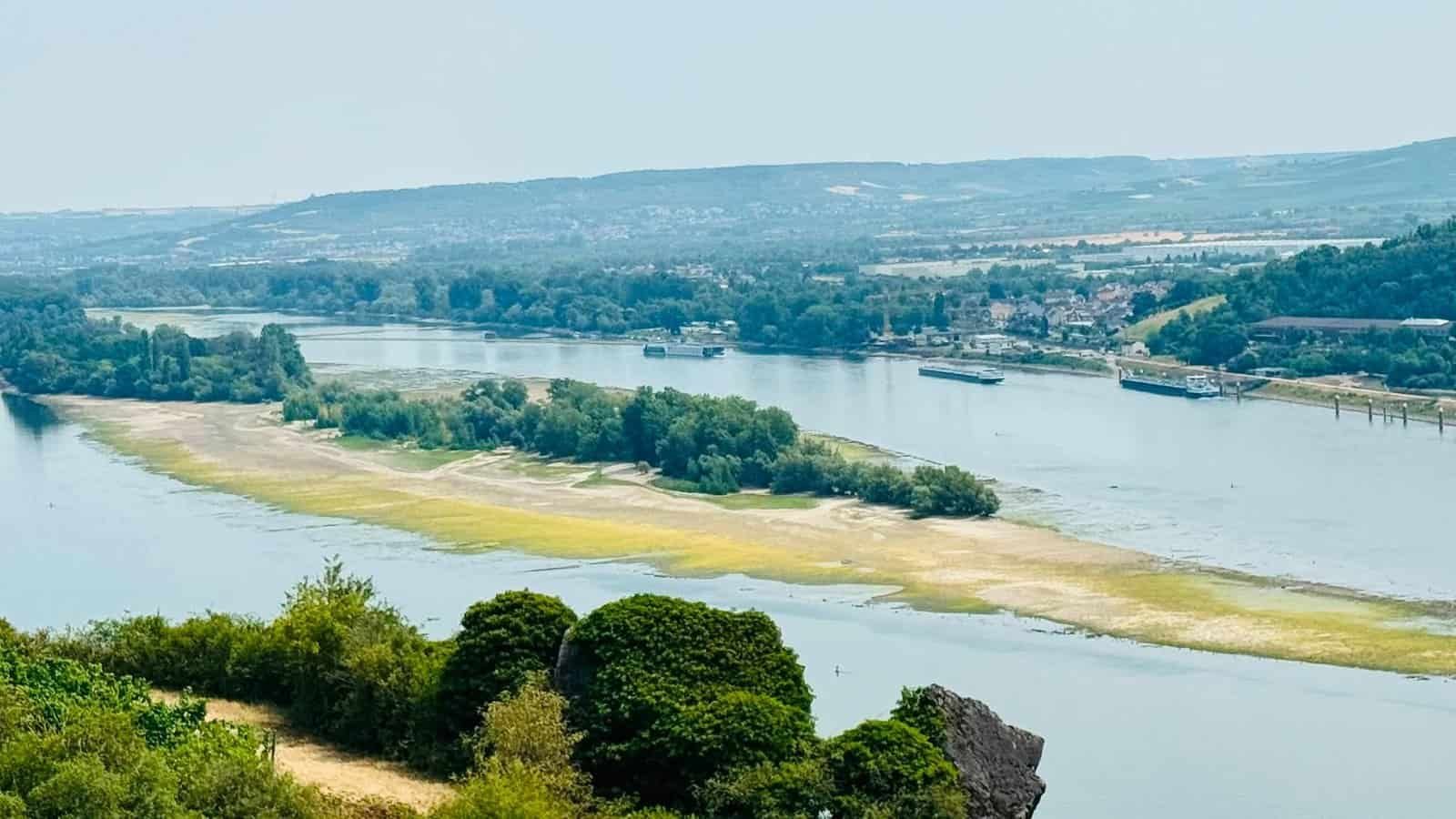 Low water on the Rhine River with exposed sandbars and a narrowed shipping channel